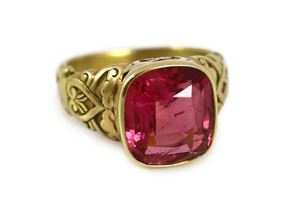 An antique Tiffany & Co gold and singe stone cushion cut rubellite set dress ring